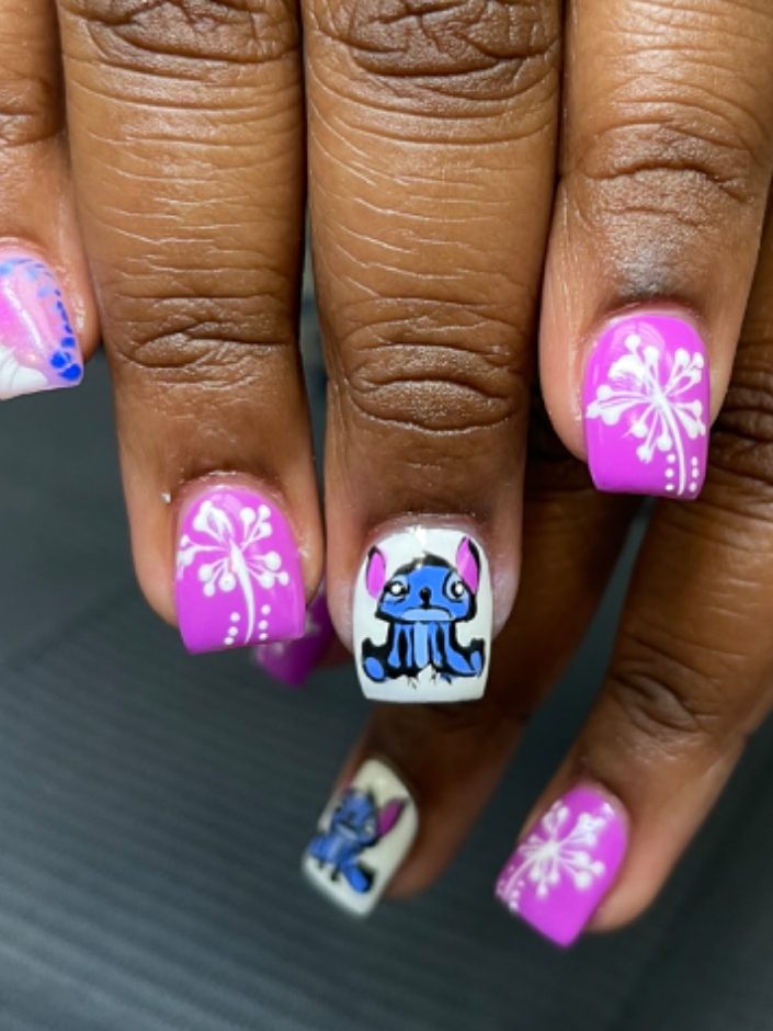 Hand painted art on nails, with complementary colors.